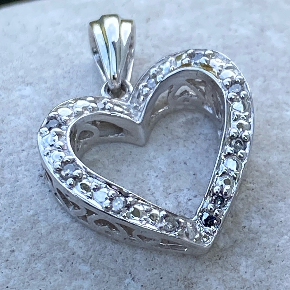 Solid 10k white gold heart pendant with genuine Diamond accent stones